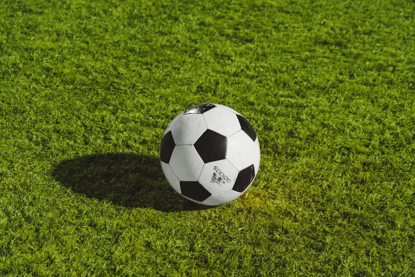 Football on a grass pitch