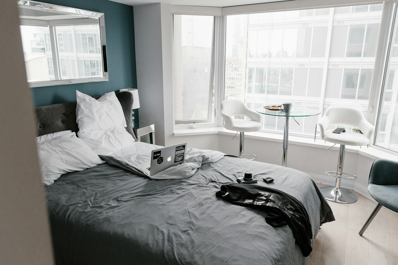 Hotel room with a laptop on the bed